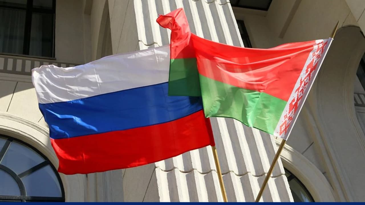 Russian and Belarusian flags displayed outside government building