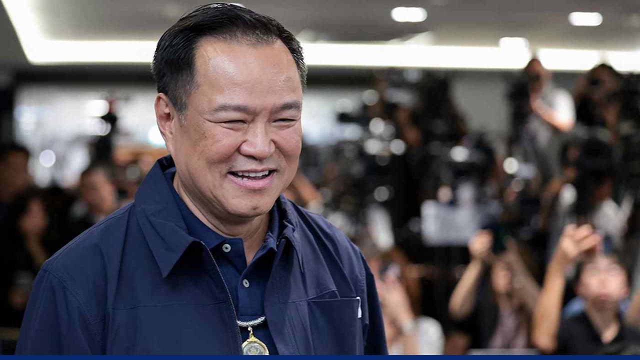 Thai prime minister smiles at election event