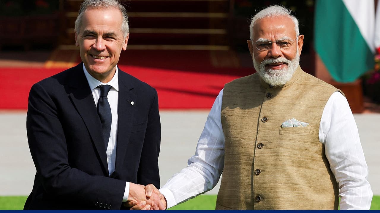 Indian and Canadian leaders shake hands during meeting