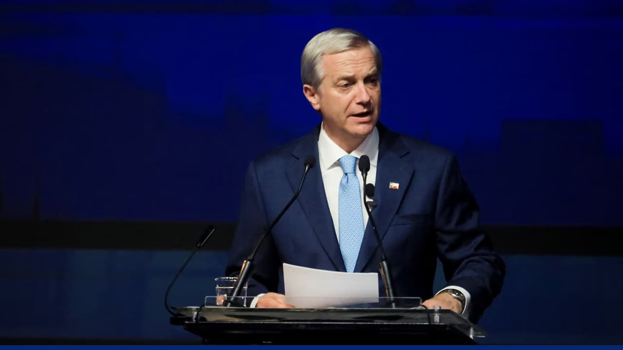 Senior government official delivering speech at international conference podium