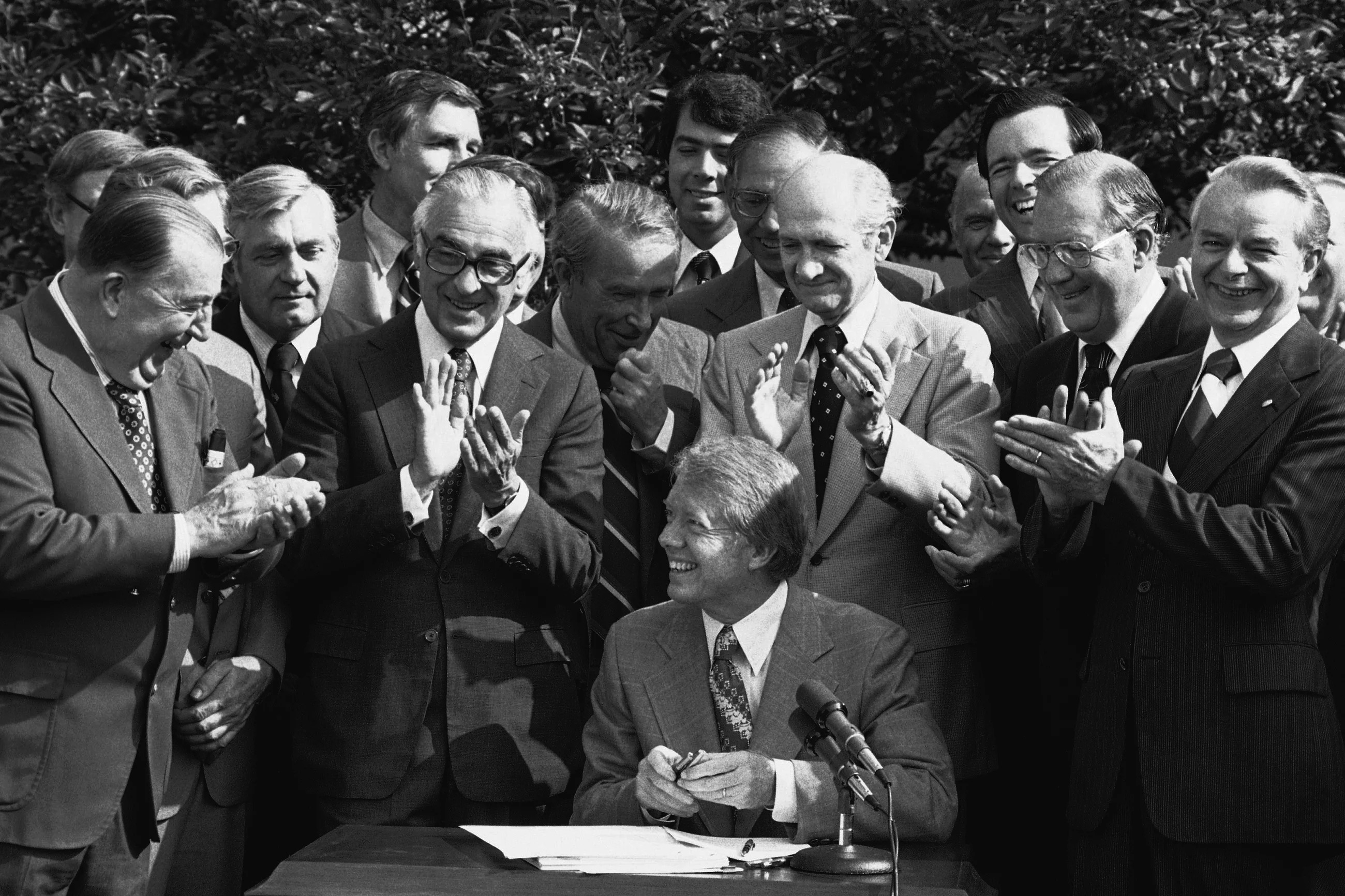 President Jimmy Carter receives the applause of members of Congress who witnessed his signature on a bill creating the Department of Energy in a Rose Garden ceremony Thursday, Aug. 4, 1977, at the White House in Washington, D.C.