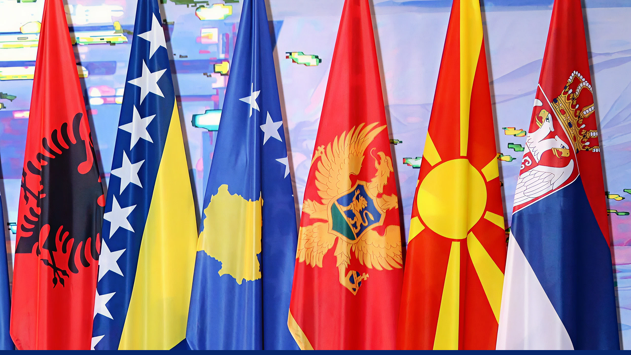 National flags of Western Balkan states arranged side by side at an international event