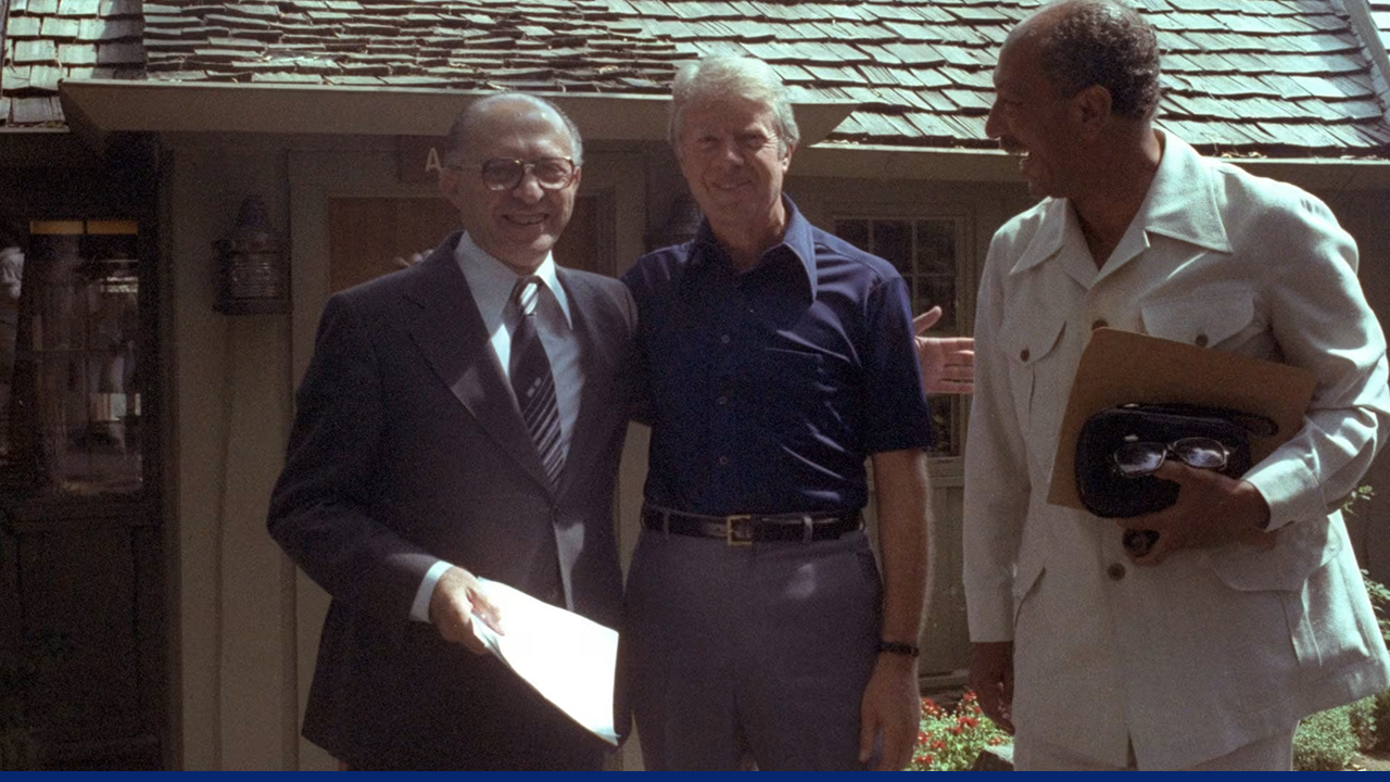 President Jimmy Carter stands with Israeli Prime Minister Menachem Begin and Egyptian President Anwar Sadat at Camp David during peace negotiations in 1978.