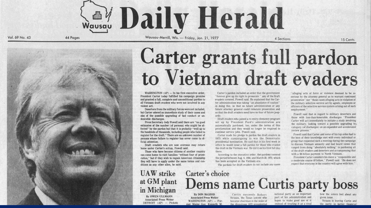 Front page of the Daily Herald newspaper from January 21, 1977, with the headline “Carter grants full pardon to Vietnam draft evaders,” accompanied by a smiling photo of President Jimmy Carter.