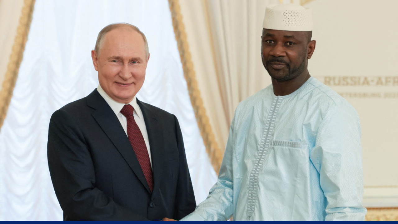 President Vladimir Putin shakes hands with Mali's President Assimi Goita during a meeting following the Russia-Africa summit in Saint Petersburg
